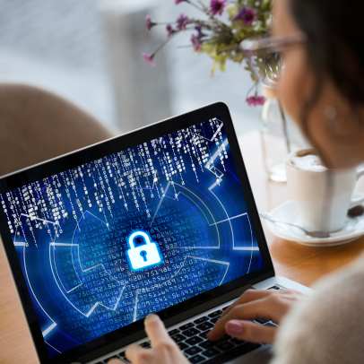 woman on laptop with lock icon on screen